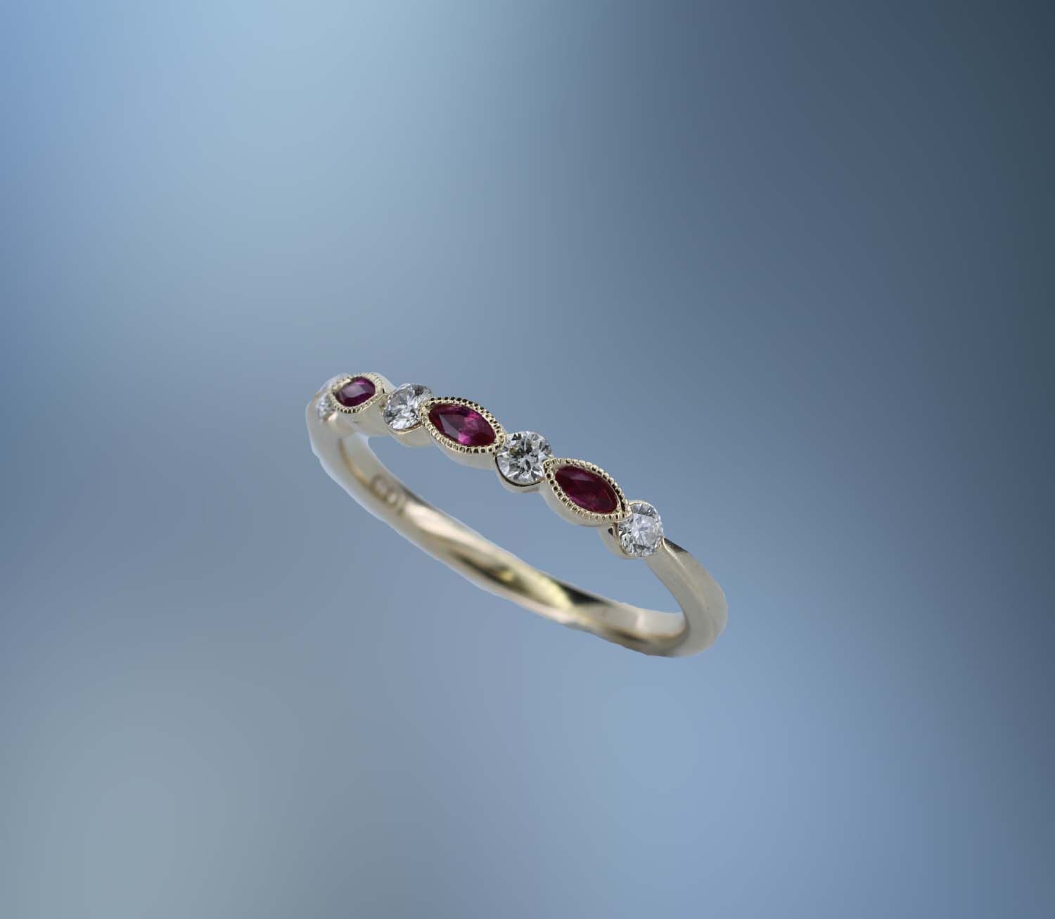 14KT YELLOW GOLD DIAMOND & RUBY BAND CONTAINING 4 ROUND BRILLIANT DIAMONDS TOTALING .19 CTS & 3 MARQ RUBIES TOTALING .14 CTS 14KT YELLOW GOLD DIAMOND & RUBY BAND CONTAINING 4 ROUND BRILLIANT DIAMONDS TOTALING .19 CTS & 3 MARQ RUBIES TOTALING .14 CTS