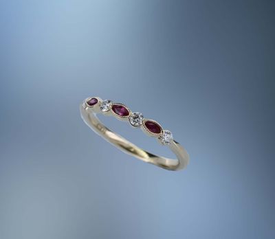 14KT YELLOW GOLD DIAMOND & RUBY BAND CONTAINING 4 ROUND BRILLIANT DIAMONDS TOTALING .19 CTS & 3 MARQ RUBIES TOTALING .14 CTS 14KT YELLOW GOLD DIAMOND & RUBY BAND CONTAINING 4 ROUND BRILLIANT DIAMONDS TOTALING .19 CTS & 3 MARQ RUBIES TOTALING .14 CTS