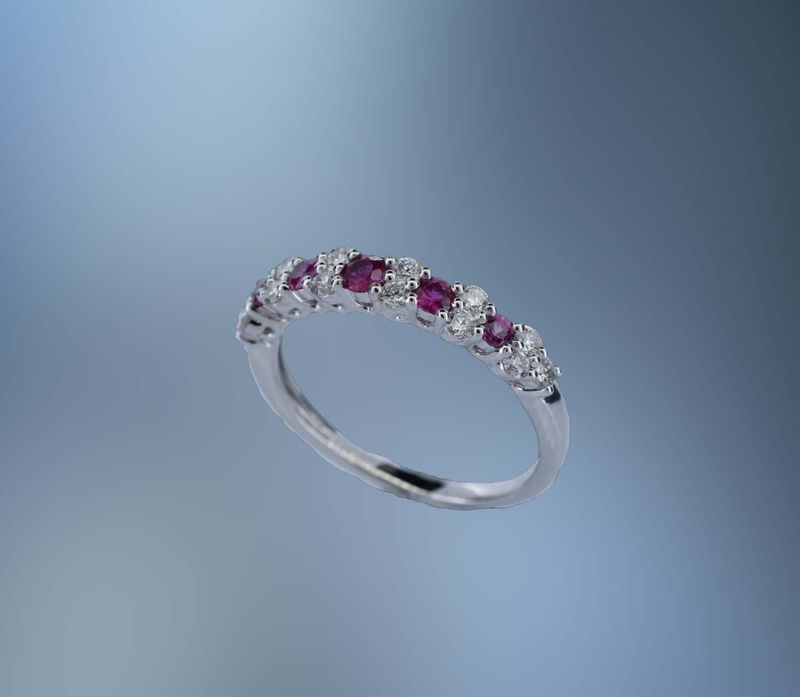ONE 14KT WHITE GOLD LADYS NATURAL RUBY AND DIAMOND RING CONTAINING .35 CTTW OF NATURAL ROUND BRILLIANT CUT DIAMONDS AND .31 CTTW OF NATURAL ROUND BRILLIANT CUT RUBYS