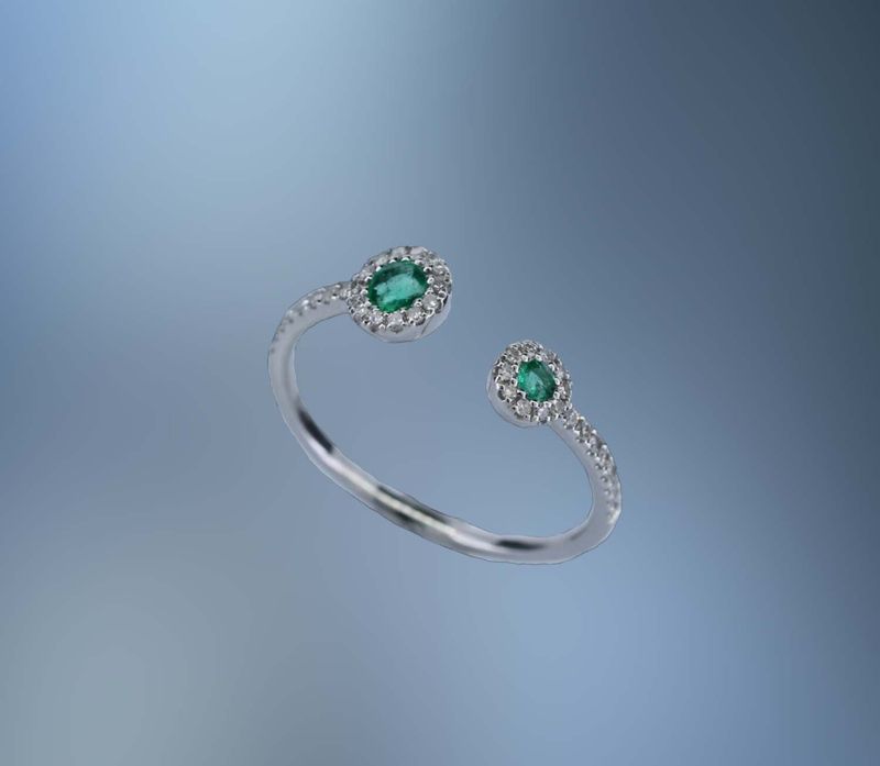 ONE 14KT WHITE GOLD LADYS NATURAL EMERALD AND DIAMOND RING CONTAINING .13 CTTW OF NATURAL  SINGLE CUT  DIAMONDS AND TWO NATURAL ROUND BRILLIANT CUT EMERALDS  .15 CTTW