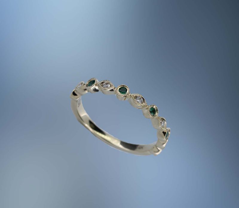 ONE 14KT YELLOW GOLD LADIES EMERALD AND DIAMOND RING CONTAINING .08 CTS. OF ROUND BRILLIANT CUT NATURAL DIAMONDS AND .18 CTS. OF ROUND BRILLIANT CUT EMERALDS