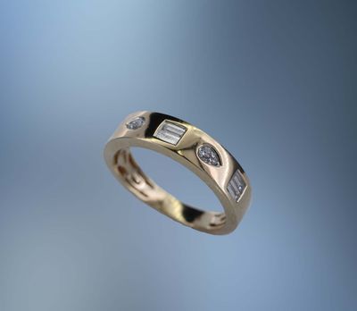 ONE 14KT YELLOW GOLD LADIES FASHION RING CONTAINING .07 CTS. OF NATURAL ROUND BRILLIANT CUT DIAMONDS AND .18 CTS OF NATURAL STRAIGHT BAGUETTES.