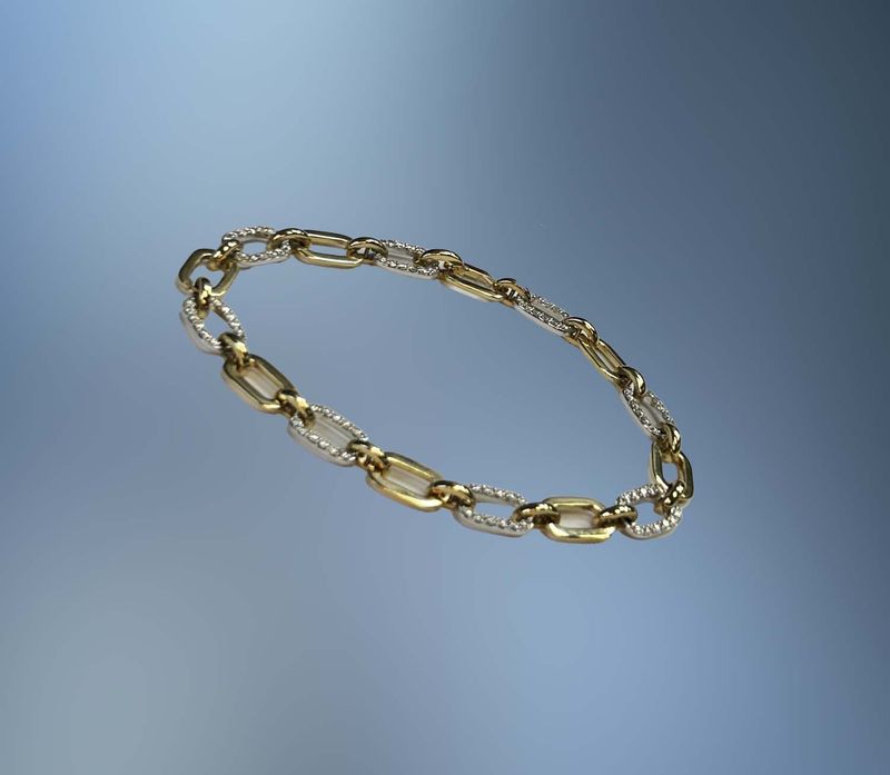 14KT TWO TONE DIAMOND BRACELET FEATURING 1.10 CTS OF ROUND BRILLIANT DIAMONDS