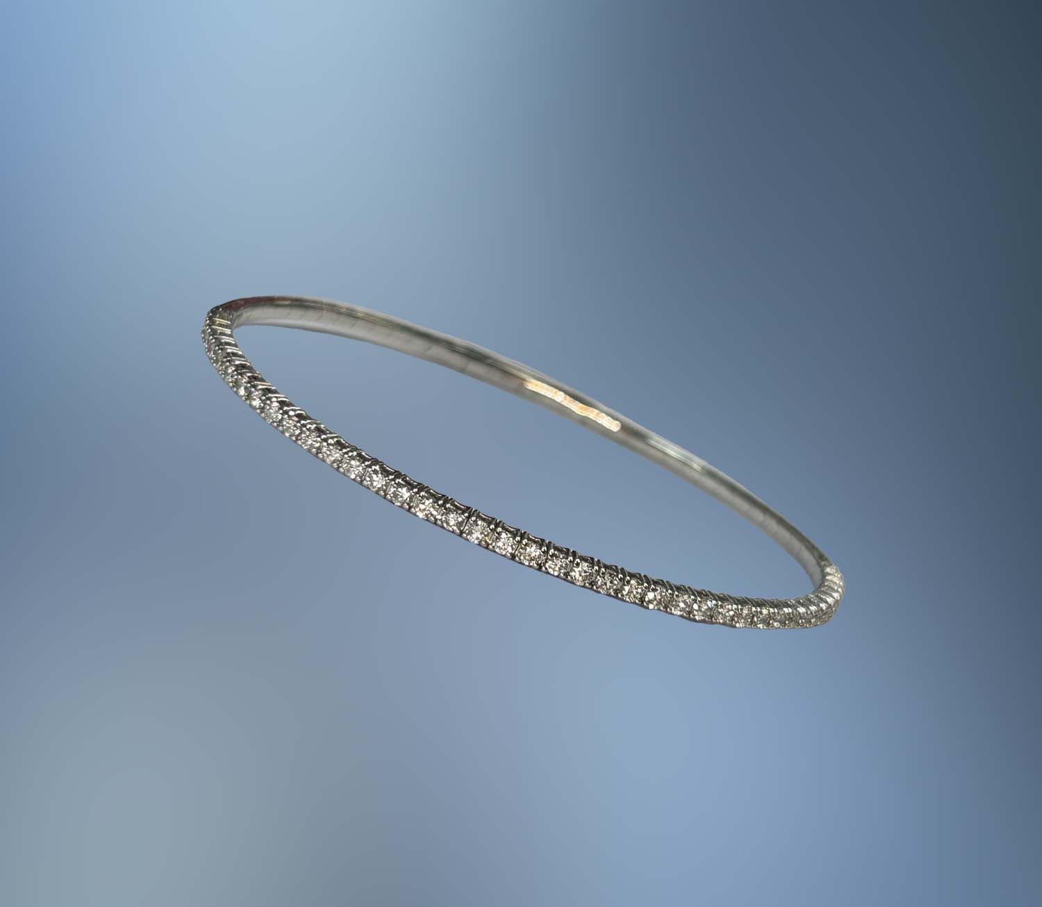 14KT WHITE GOLD FLEXIBLE BANGLE BRACELET FEATURING 37 ROUND BRILLIANT DIAMONDS TOTALING 1.47 CTS 14KT WHITE GOLD FLEXIBLE BANGLE BRACELET FEATURING 37 ROUND BRILLIANT DIAMONDS TOTALING 1.47 CTS
