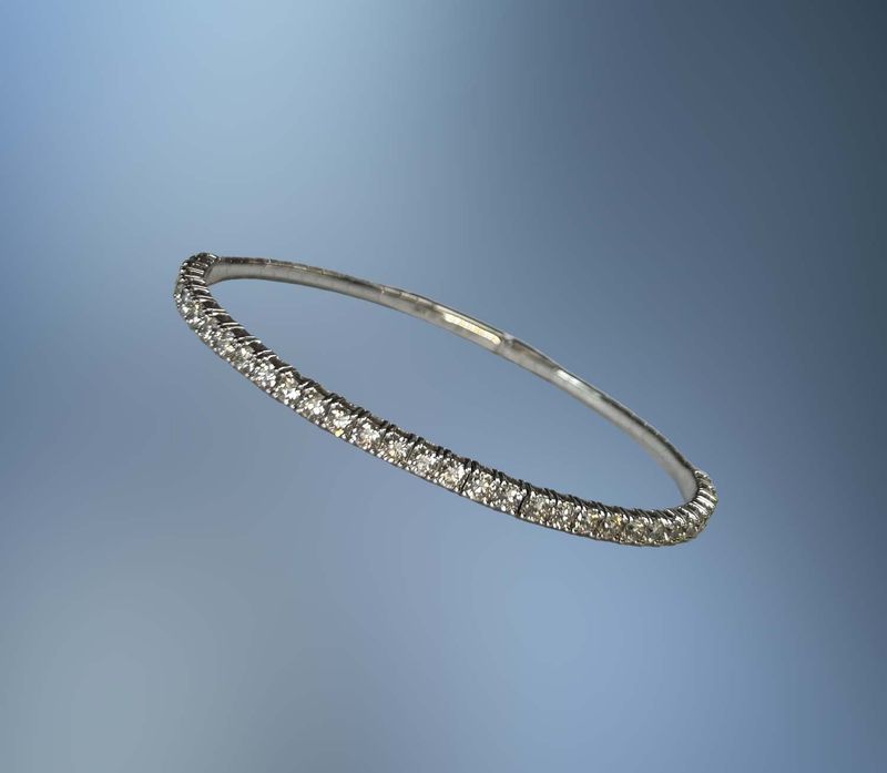 18KT WHITE GOLD DIAMOND BRACELET FEATURING 41 ROUND BRILLIANT DIAMONDS TOTALING 11.58 CTS