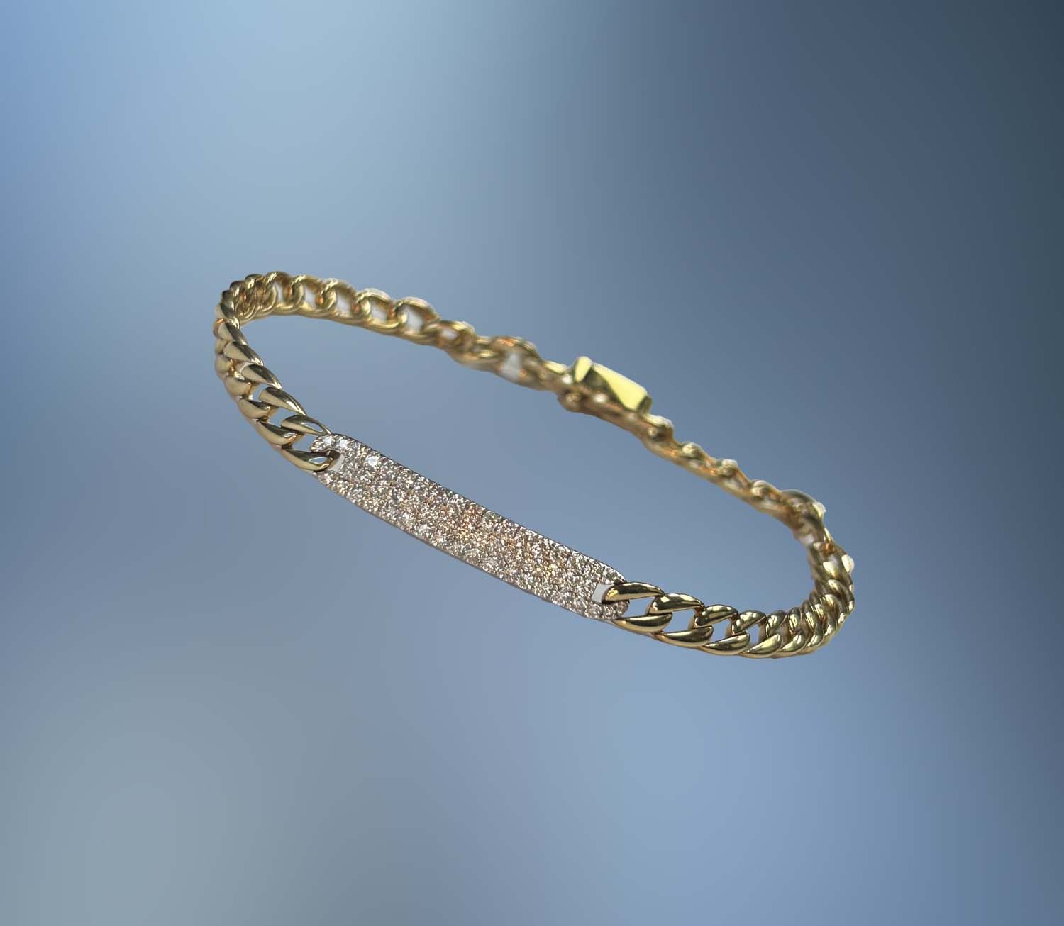 14KT WHITE AND YELLOW GOLD DIAMOND 14KT WHITE AND YELLOW GOLD DIAMOND "ID" BRACELET FEATURING 53 ROUND BRILLIANT CUT DIAMONDS TOTALING .71 CTS. WITH A CURB LINK AND A HIDDEN BOX CLASP WITH SAFETY.