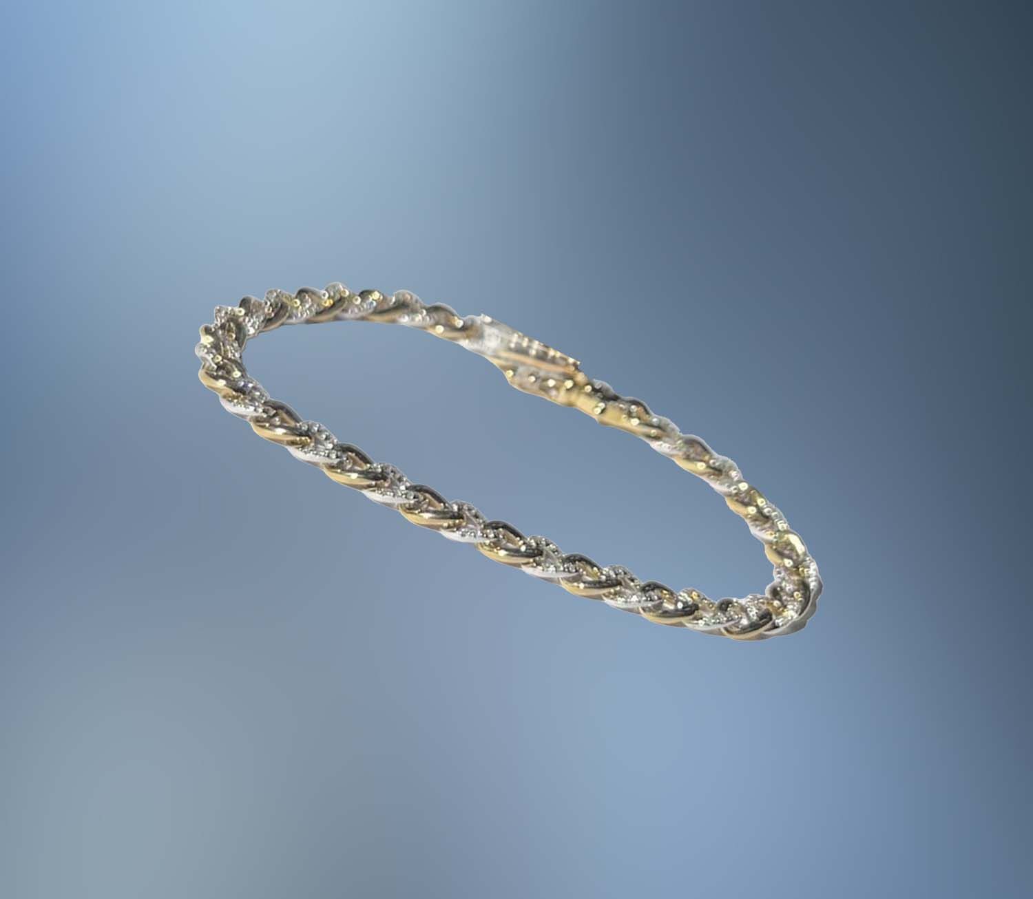 ONE 14KT WHITE AND YELLOW GOLD DIAMOND BRACELET CONTAINING .79 CTS OF NATURAL ROUND BRILLIANT CUT DIAMONDS