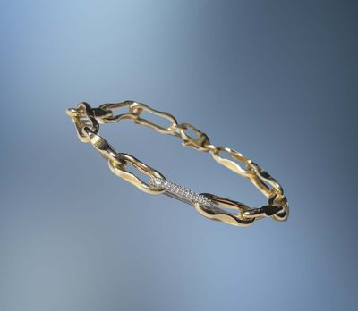 ONE 14KT YELLOW GOLD LADIES DIAMOND PAPERCLIP BRACELET 8" IN LENGTH CONTAINING .65 CTS OF NATURAL ROUND BRILLIANT CUT DIAMONDS.