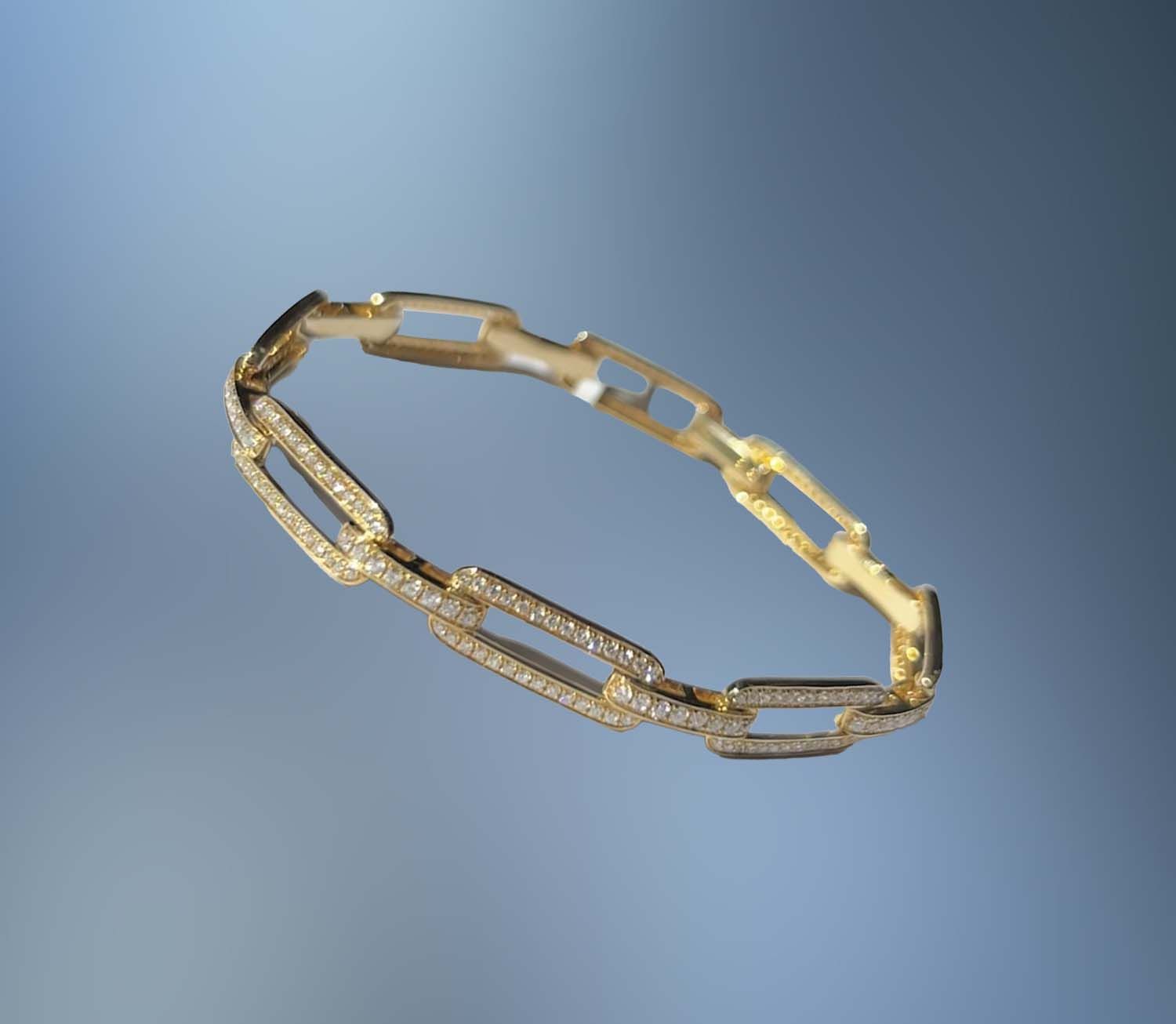ONE 14KT YELLOW GOLD LADIES DIAMOND PAPERCLIP LINK BRACELET CONTAINING 1.85 CTS. OF NATURAL ROUND BRILLIANT CUT DIAMONDS WITH A FOLD OVER CLASP ONE 14KT YELLOW GOLD LADIES DIAMOND PAPERCLIP LINK BRACELET CONTAINING 1.85 CTS. OF NATURAL ROUND BRILLIANT CUT DIAMONDS WITH A FOLD OVER CLASP