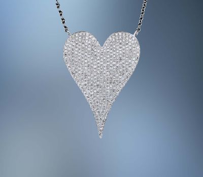 14KT WHITE GOLD DIAMOND HEART PENDANT FEATURING PAVÉ SET ROUND BRILLIANT CUT DIAMONDS TOTALING 0.83 CTS 14KT WHITE GOLD DIAMOND HEART PENDANT FEATURING PAVÉ SET ROUND BRILLIANT CUT DIAMONDS TOTALING 0.83 CTS