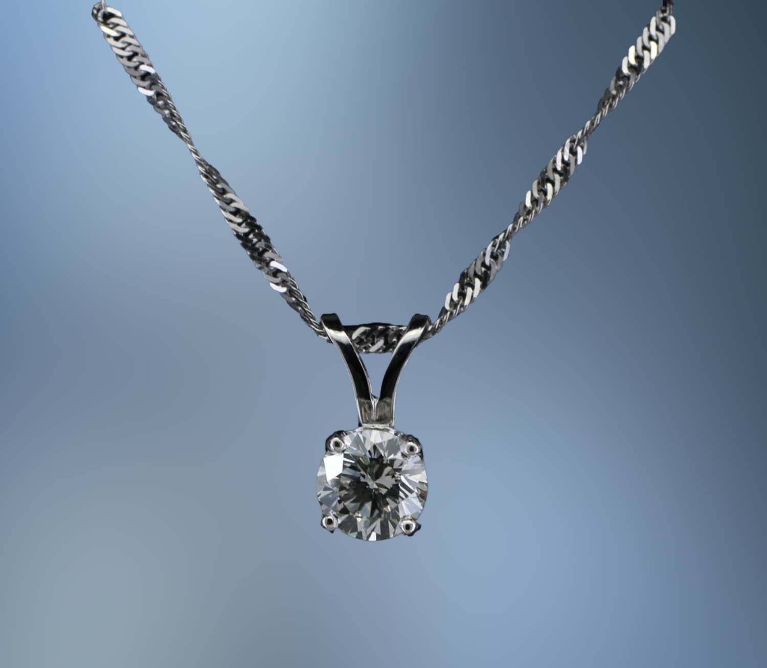 14KT WHITE GOLD DIAMOND PENDANT  FEATURING A ROUND BRILLIANT CUT DIAMOND TOTALING  .46 CTS