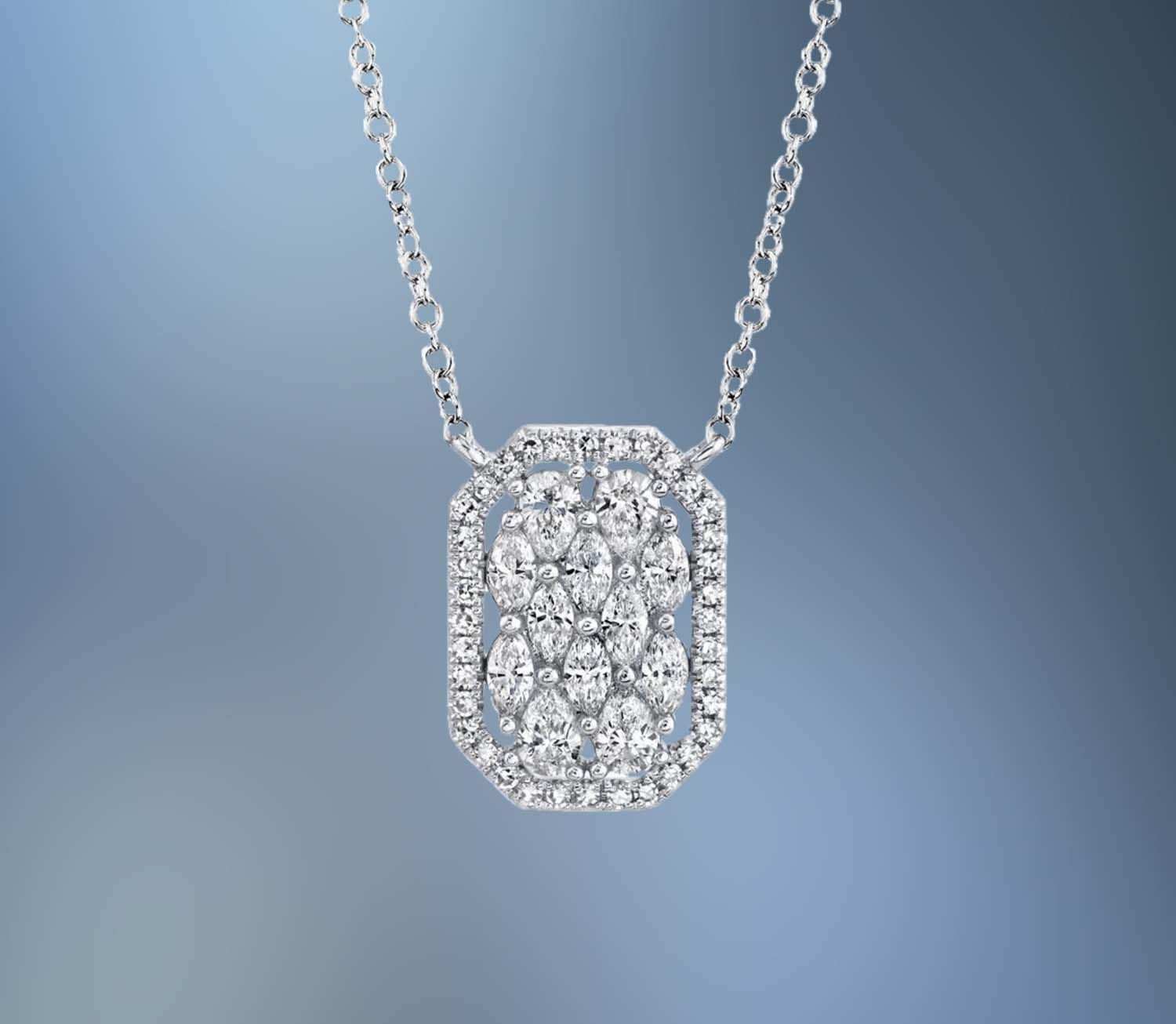14KT WHITE GOLD DIAMOND PENDANT FEATURING 4 PEAR SHAPED DIAMONDS, 8 MARQUISE SHAPED DIAMONDS, AND 35 ROUND BRILLIANT CUT DIAMONDS TOTALING 0.62 CTS. 14KT WHITE GOLD DIAMOND PENDANT FEATURING 4 PEAR SHAPED DIAMONDS, 8 MARQUISE SHAPED DIAMONDS, AND 35 ROUND BRILLIANT CUT DIAMONDS TOTALING 0.62 CTS.