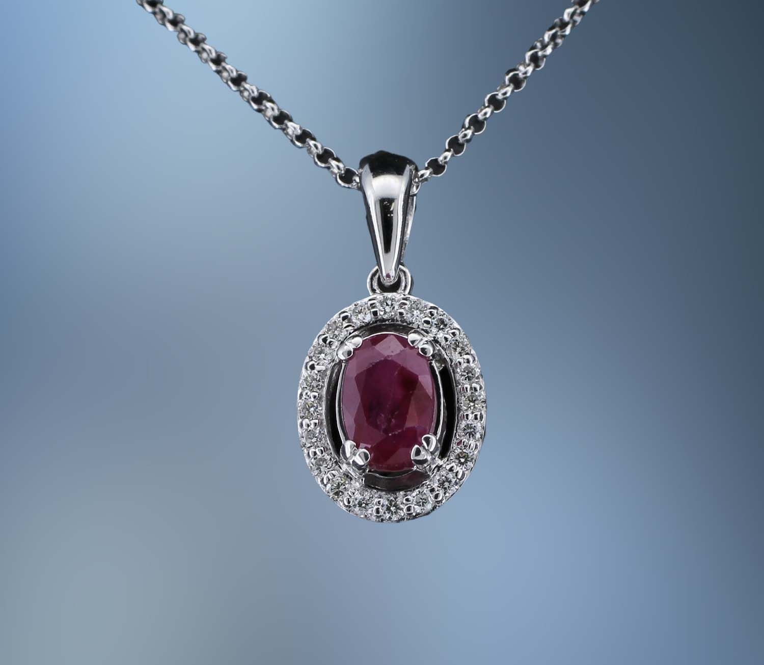 14KT WHITE GOLD DIAMOND & RUBY NECKLACE FEATURING A RUBY TOTALING 0.70 CTS & DIAMONDS TOTALING 0.12 CTS 14KT WHITE GOLD DIAMOND & RUBY NECKLACE FEATURING A RUBY TOTALING 0.70 CTS & DIAMONDS TOTALING 0.12 CTS