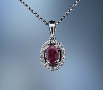 14KT WHITE GOLD DIAMOND & RUBY  NECKLACE  FEATURING A RUBY TOTALING 0.70 CTS & DIAMONDS TOTALING 0.12 CTS