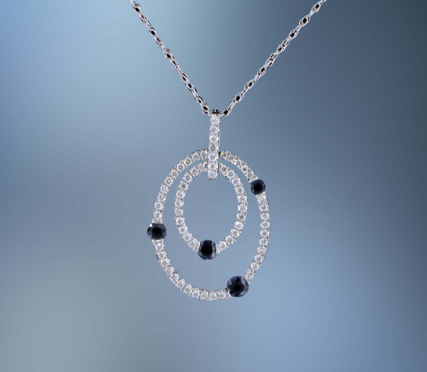 14KT WHITE GOLD DIAMOND & SAPPHIRE PENDANT FEATURING 4 SAPPHIRES TOTALING 0.37 CTS AND 40 ROUND BRILLIANT CUT DIAMONDS TOTALING  0.32 CTS