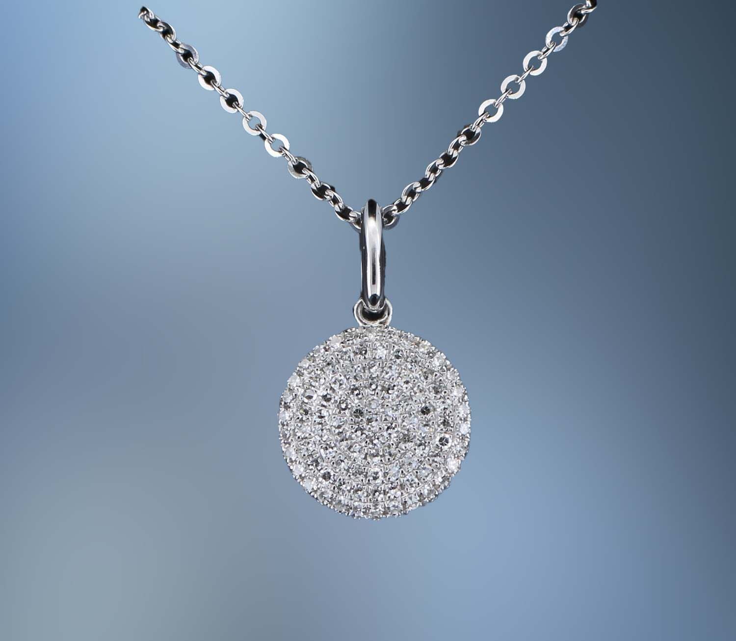 14KT WHITE GOLD DISC PENDANT FEATURING  ROUND BRILLIANT CUT DIAMONDS TOTALING 0.23 CTS