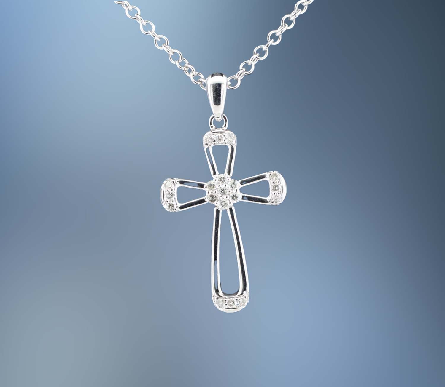 14 KARAT WHITE GOLD DIAMOND CROSS PENDANT CONTAINING 19 ROUND BRILLIANT CUT DIAMONDS TOTALING 0.11 CARAT