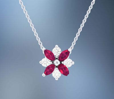14 KARAT WHITE GOLD NATURAL DIAMOND AND RUBY PENDANT CONTAINING 4 NATURAL MARQUISE RUBIES TOTALING 0.4 CARATS AND 4 NATURAL ROUND BRILLIANT CUT DIAMONDS TOTALING 0.18 CARATS