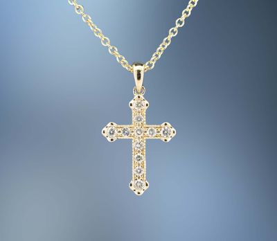 14 KARAT YELLOW GOLD DIAMOND CROSS PENDANT CONTAINING 11 ROUND BRILLIANT CUT DIAMONDS TOTALING 0.24 CARATS 14 KARAT YELLOW GOLD DIAMOND CROSS PENDANT CONTAINING 11 ROUND BRILLIANT CUT DIAMONDS TOTALING 0.24 CARATS