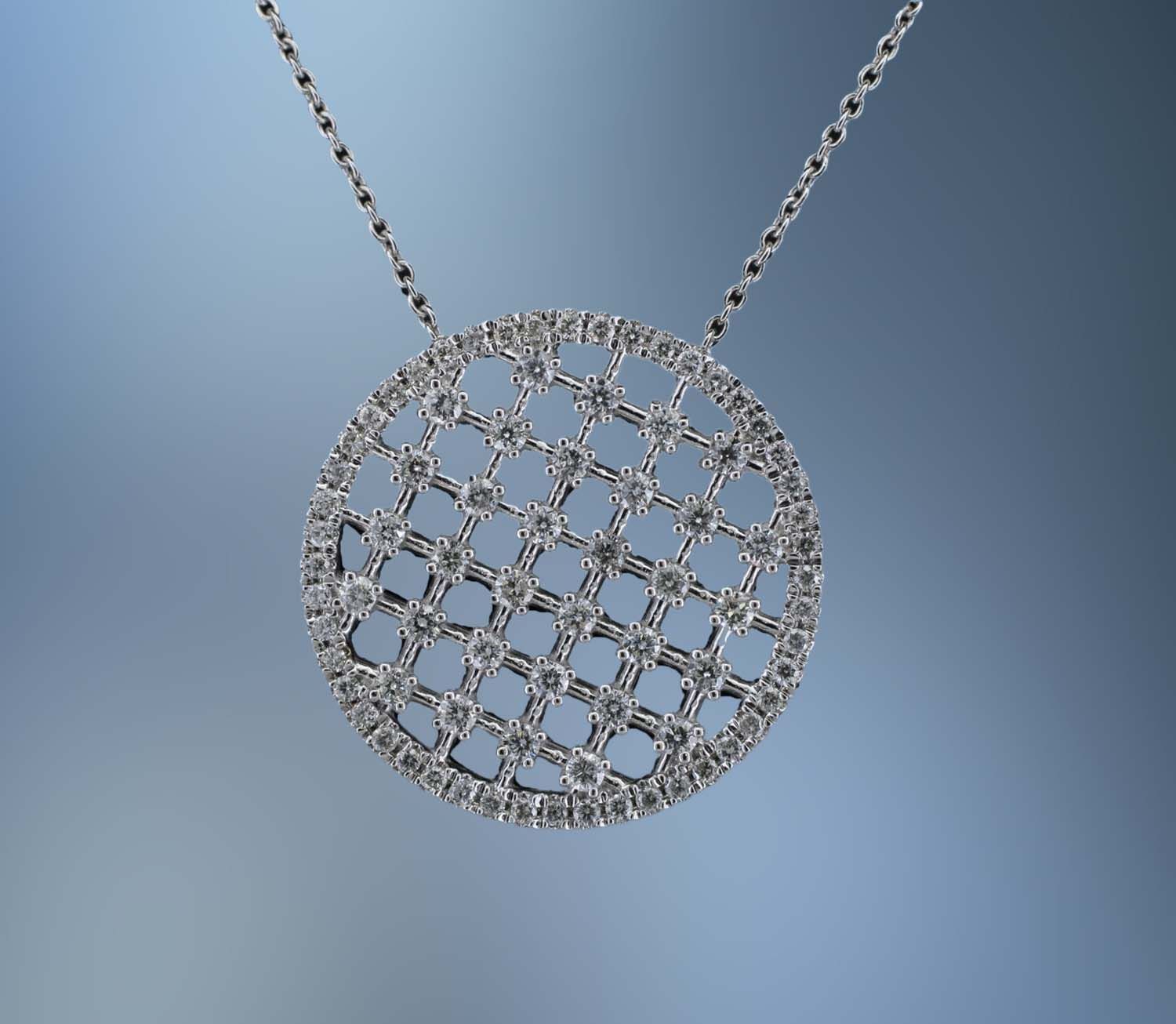 14KT WHITE GOLD DIAMOND CIRCLE PENDANT FEATURING 80 ROUND BRILLIANT DIAMONDS TOTALING .71 CTS