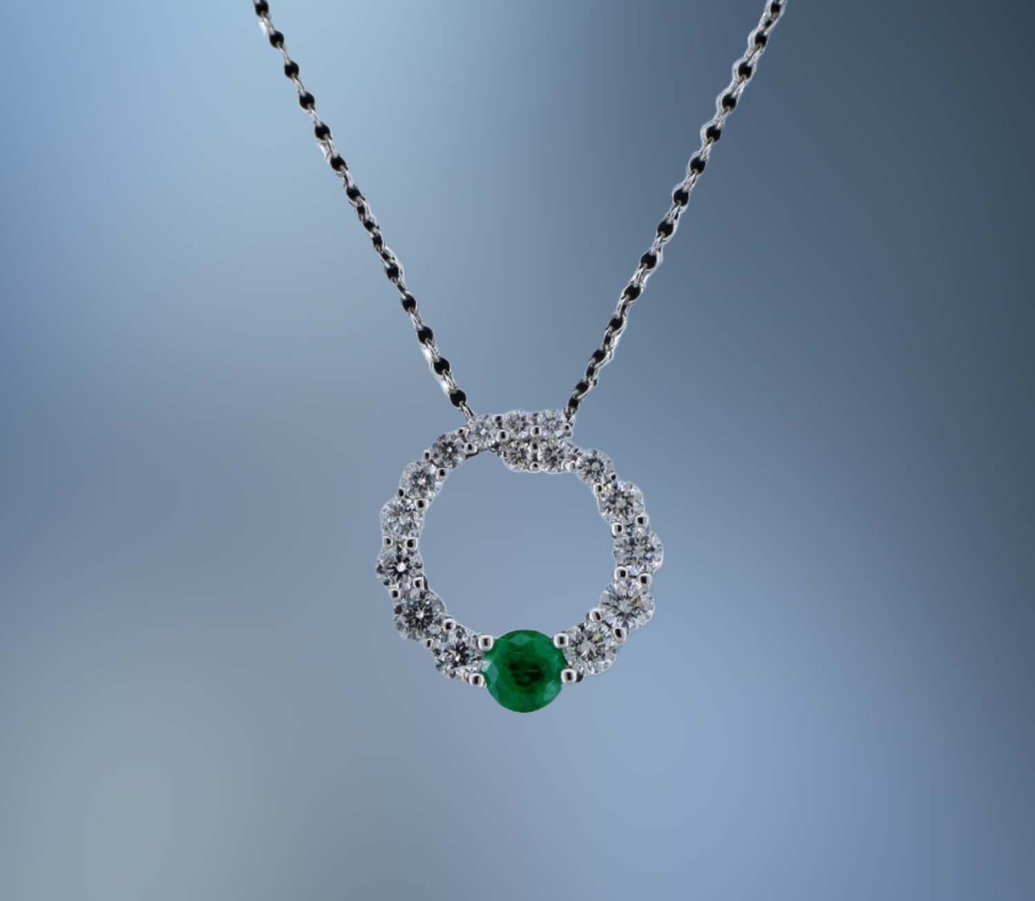 14KT WHITE GOLD DIAMOND AND EMERALD PENDANT ON A 16 14KT WHITE GOLD DIAMOND AND EMERALD PENDANT ON A 16" CHAIN FEATURING ONE .14CT EMERALD & 16 ROUND BRILLIANT CUT DIAMONDS TOTALING .36 CTS