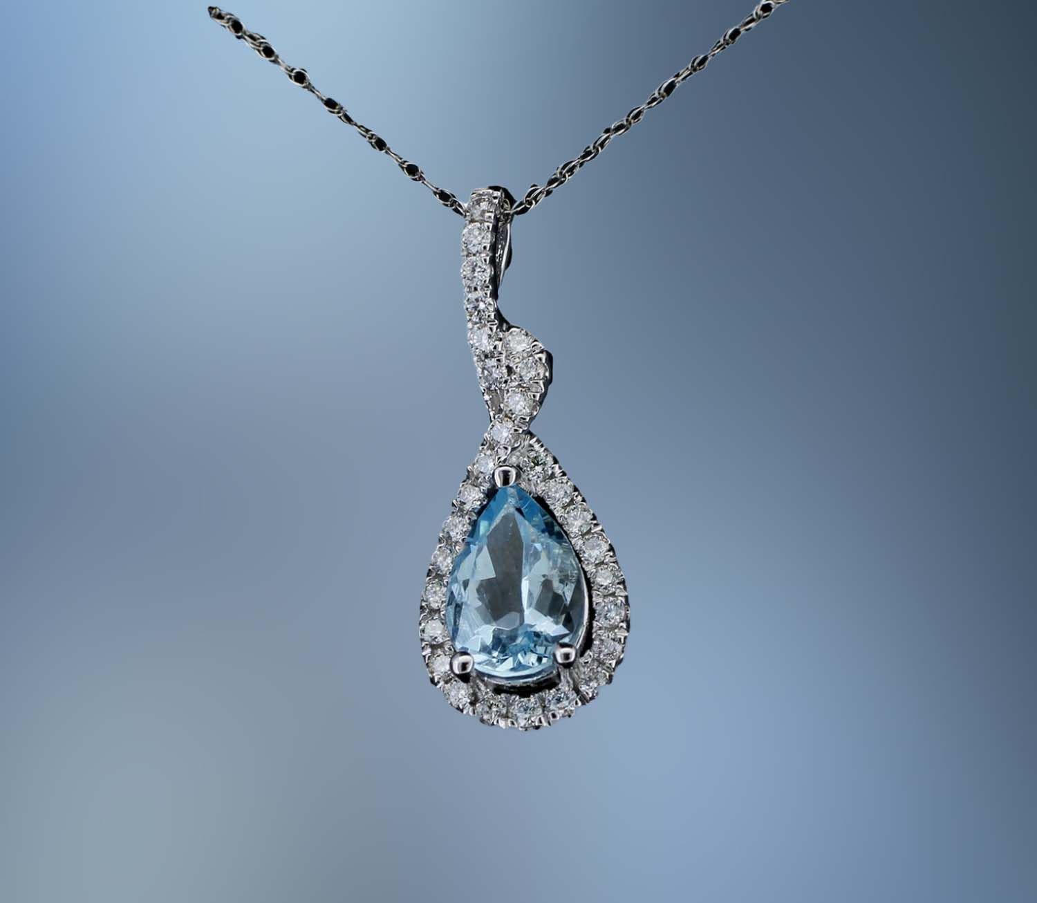 14KT WHITE GOLD DIAMOND & AQUAMARINE DIAMOND PENDANT FEATURING A 1.10 CT AQUAMARINE & DIAMONDS TOTALING .30 CTS 14KT WHITE GOLD DIAMOND & AQUAMARINE DIAMOND PENDANT FEATURING A 1.10 CT AQUAMARINE & DIAMONDS TOTALING .30 CTS