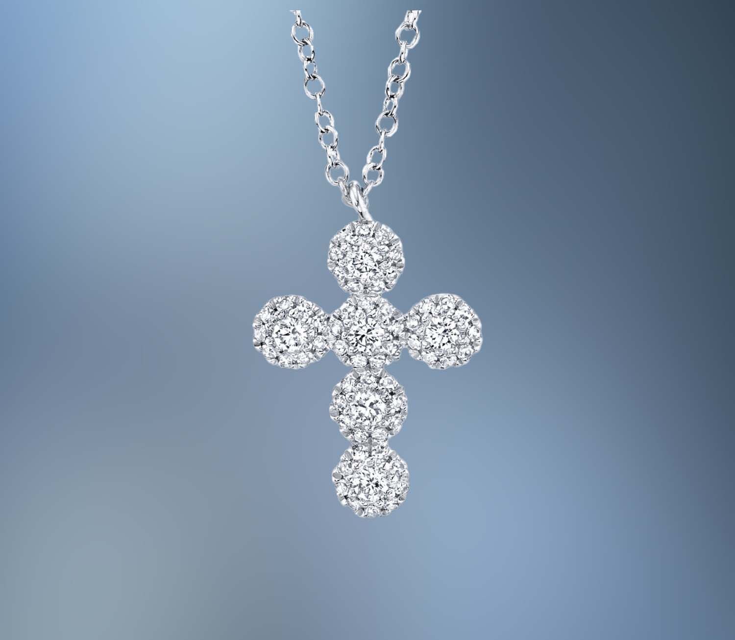 14KT WHITE GOLD DIAMOND CROSS PENDANT FEATURING 60 ROUND BRILLIANT CUT DIAMONDS TOTALING 0.25 CTS. .
