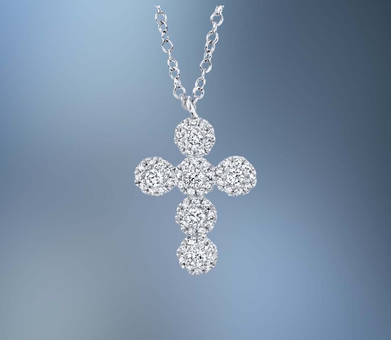 14KT WHITE GOLD DIAMOND CROSS PENDANT FEATURING 60 ROUND BRILLIANT CUT DIAMONDS TOTALING 0.25 CTS. .
