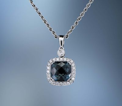 14KT WHITE GOLD NECKLACE & CHAIN FEATURING A BLUE TOPAZ TOTALING 1.63 CTS AND 25 ROUND BRILLIANT CUT DIAMONDS TOTALING 0.17 CTS 14KT WHITE GOLD NECKLACE & CHAIN FEATURING A BLUE TOPAZ TOTALING 1.63 CTS AND 25 ROUND BRILLIANT CUT DIAMONDS TOTALING 0.17 CTS