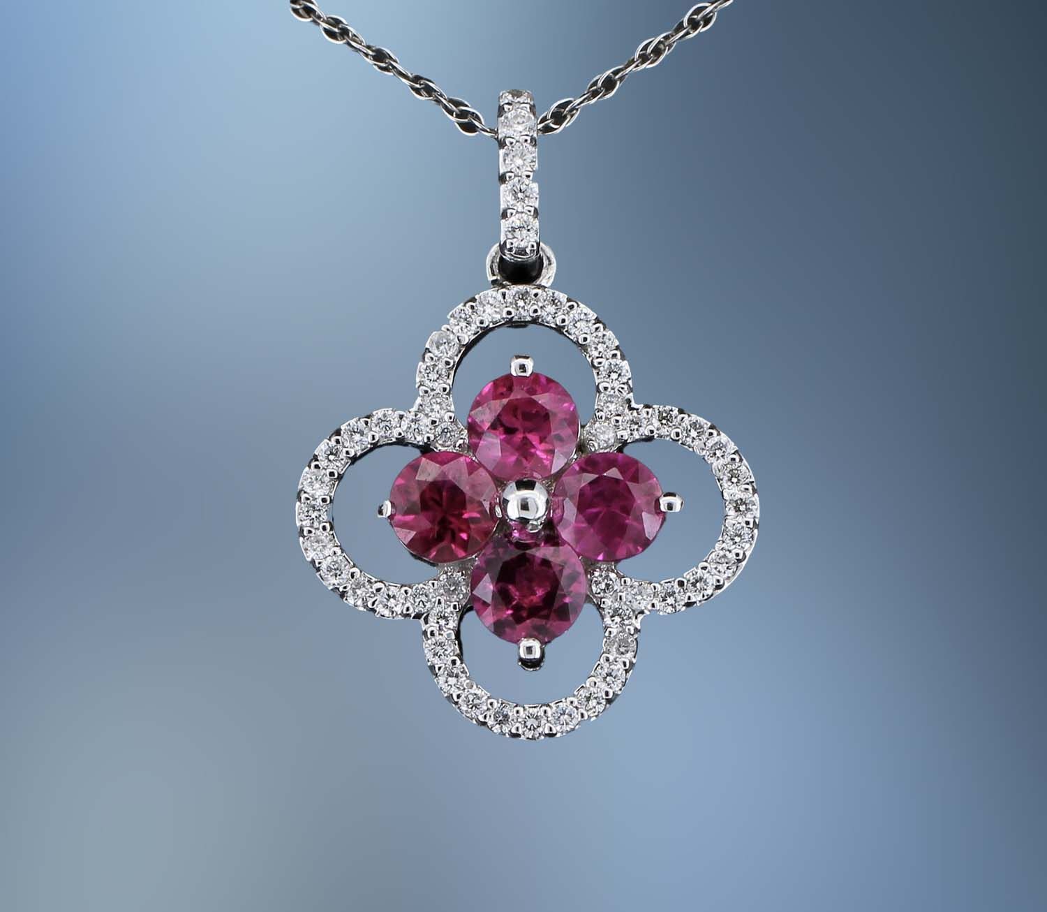 14KT WHITE GOLD  PENDANT & CHAIN FEATURING 4 RUBIES TOTALING  1.20 CTS AND 30 ROUND BRILLIANT CUT  DIAMONDS TOTALING 0.30 CTS