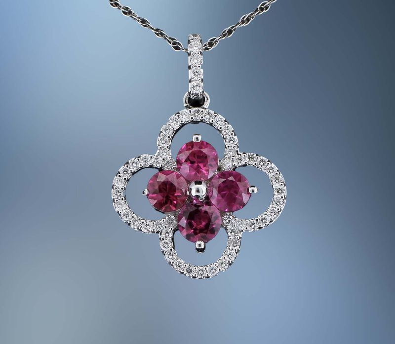 14KT WHITE GOLD  PENDANT & CHAIN FEATURING 4 RUBIES TOTALING  1.20 CTS AND 30 ROUND BRILLIANT CUT  DIAMONDS TOTALING 0.30 CTS