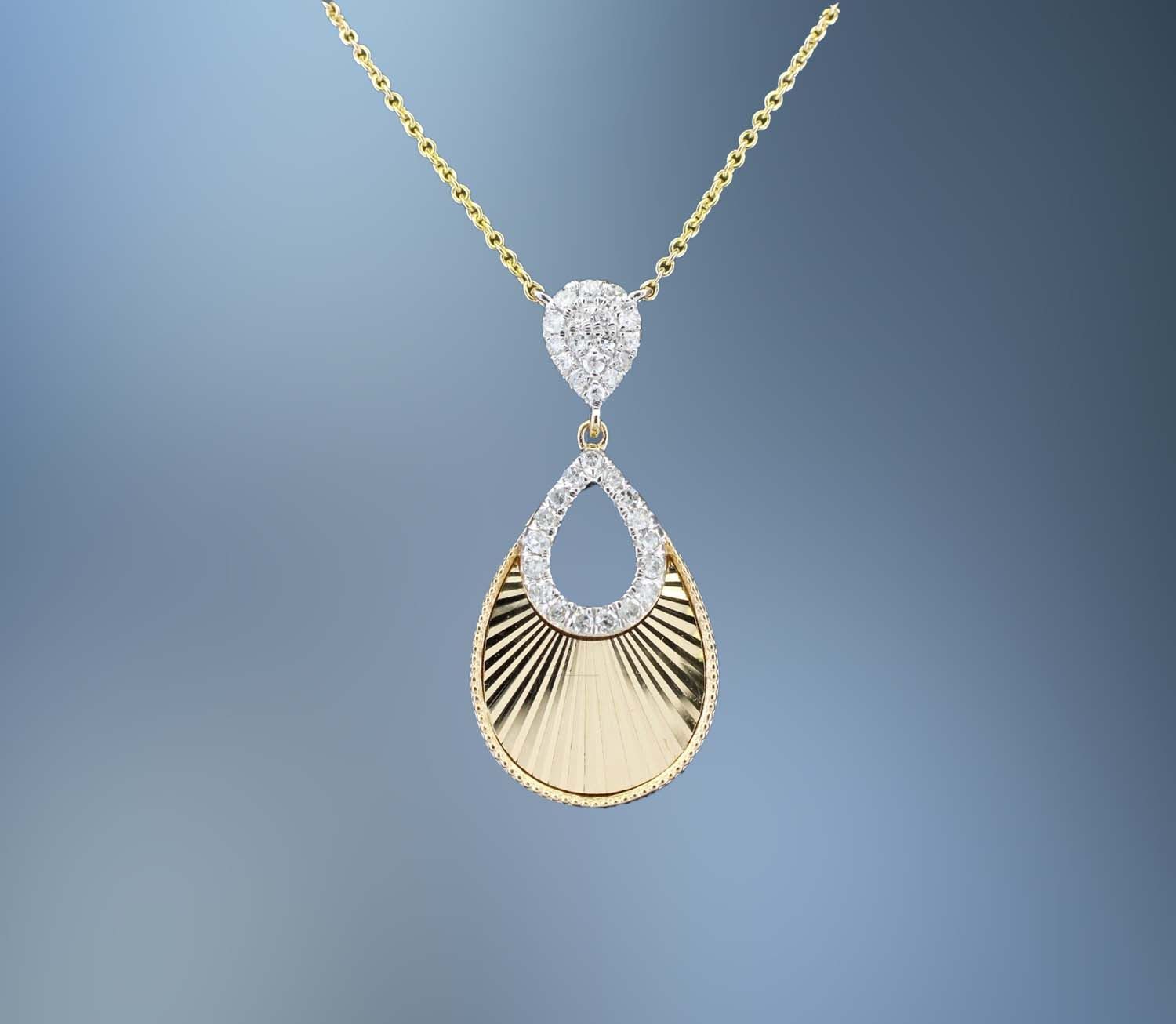 14KT YELLOW GOLD  DIAMOND PENDANT FEATURING 34 ROUND BRILLIANT CUT  DIAMONDS TOTALING .18 CTS. ON AN 18' ADJUSTABLE CHAIN