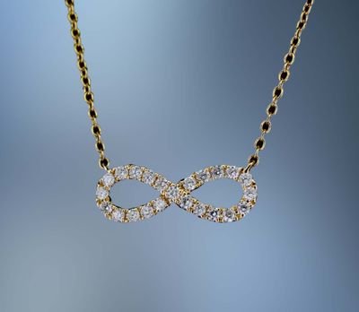 18 KT YELLOW GOLD INFINITY PENDANT FEATURING 23 ROUND BRILLIANT CUT DIAMONDS TOTALING 0.20 CTS 18 KT YELLOW GOLD INFINITY PENDANT FEATURING 23 ROUND BRILLIANT CUT DIAMONDS TOTALING 0.20 CTS