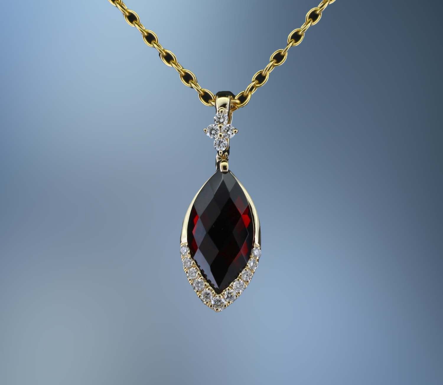 CM3980Y 14KT YELLOW GOLD DIAMOND & GARNET PENDANT FEATURING .10 CTS OF ROUND BRILLIANT DIAMONDS & ONE MARQ CUT GARNET TOTALING 1.10 CTS CM3980Y 14KT YELLOW GOLD DIAMOND & GARNET PENDANT FEATURING .10 CTS OF ROUND BRILLIANT DIAMONDS & ONE MARQ CUT GARNET TOTALING 1.10 CTS