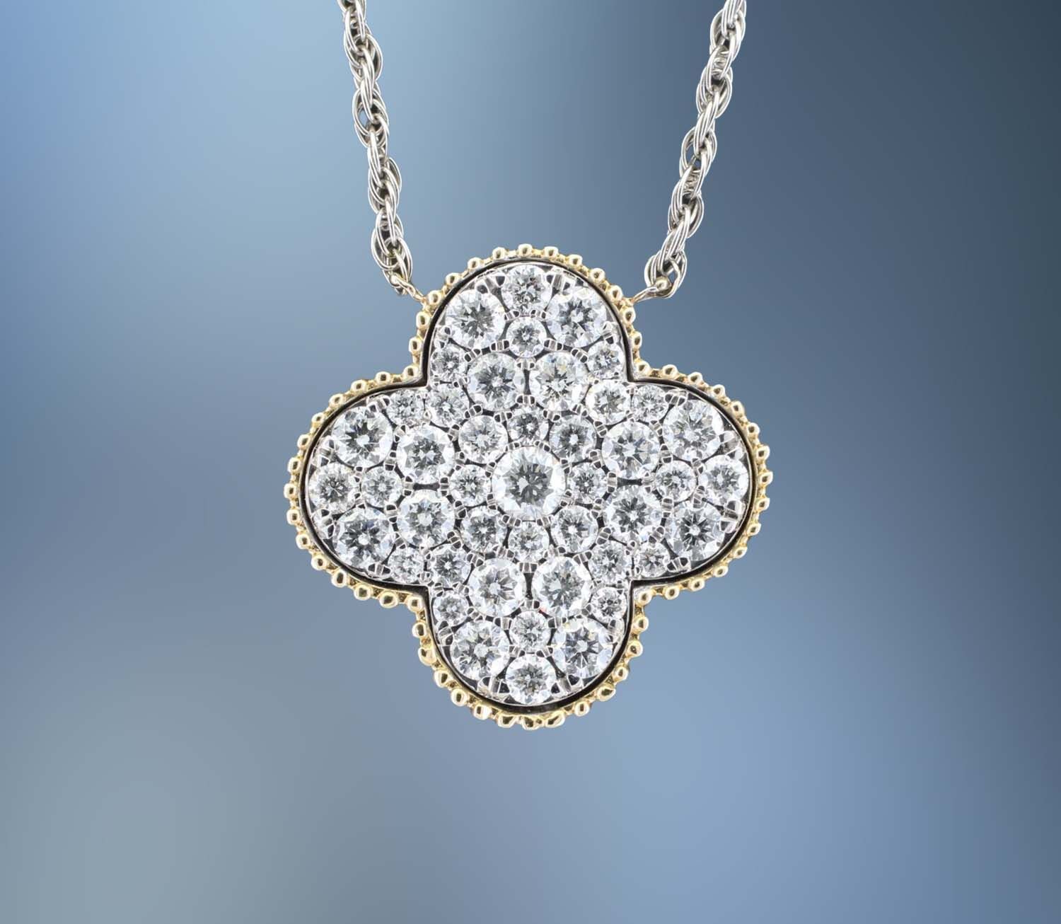 14KT YELLOW & WHITE GOLD DIAMOND PENDANT FEATURING ROUND BRILLIANT CUT DIAMONDS TOTALING 1.50 CTS 14KT YELLOW & WHITE GOLD DIAMOND PENDANT FEATURING ROUND BRILLIANT CUT DIAMONDS TOTALING 1.50 CTS