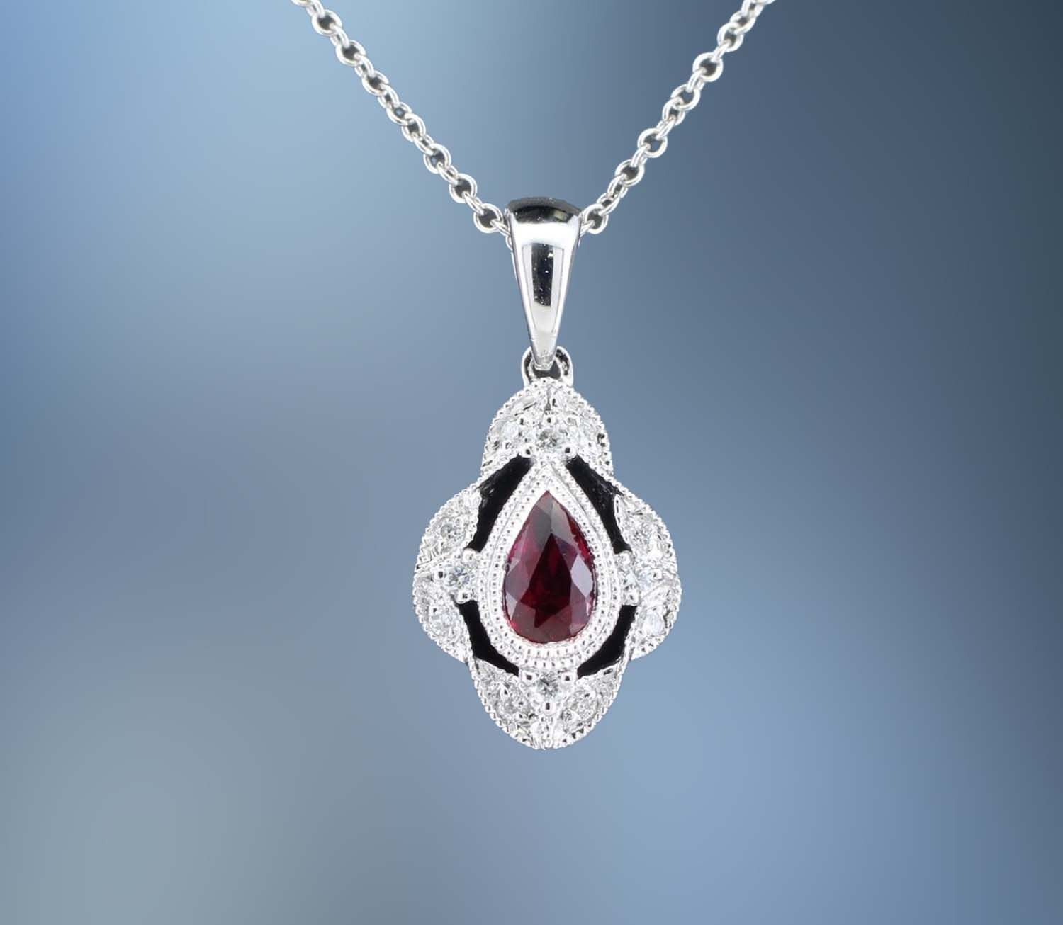 CM4258W 14KT WHITE GOLD LADY'S RUBY AND DIAMOND PENDANT FEATURING ONE .27 CT PEAR SHAPED RUBY WITH 12 ROUND BRILLIANT CUT DIAMONDS TOTALING .06 CTS. MILLGRAIN DESIGN THROUGH OUT CM4258W 14KT WHITE GOLD LADY'S RUBY AND DIAMOND PENDANT FEATURING ONE .27 CT PEAR SHAPED RUBY WITH 12 ROUND BRILLIANT CUT DIAMONDS TOTALING .06 CTS. MILLGRAIN DESIGN THROUGH OUT