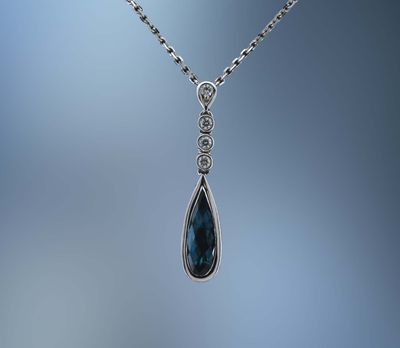 LADY'S 14KT WHITE GOLD BLUE TOPAZ & DIAMOND PENDANT FEATURING 1 FANTASY CUT BLUE TOPAZ AND 8 ROUND BRILLIANT CUT DIAMONDS TOTALING .15 CTS LADY'S 14KT WHITE GOLD BLUE TOPAZ & DIAMOND PENDANT FEATURING 1 FANTASY CUT BLUE TOPAZ AND 8 ROUND BRILLIANT CUT DIAMONDS TOTALING .15 CTS
