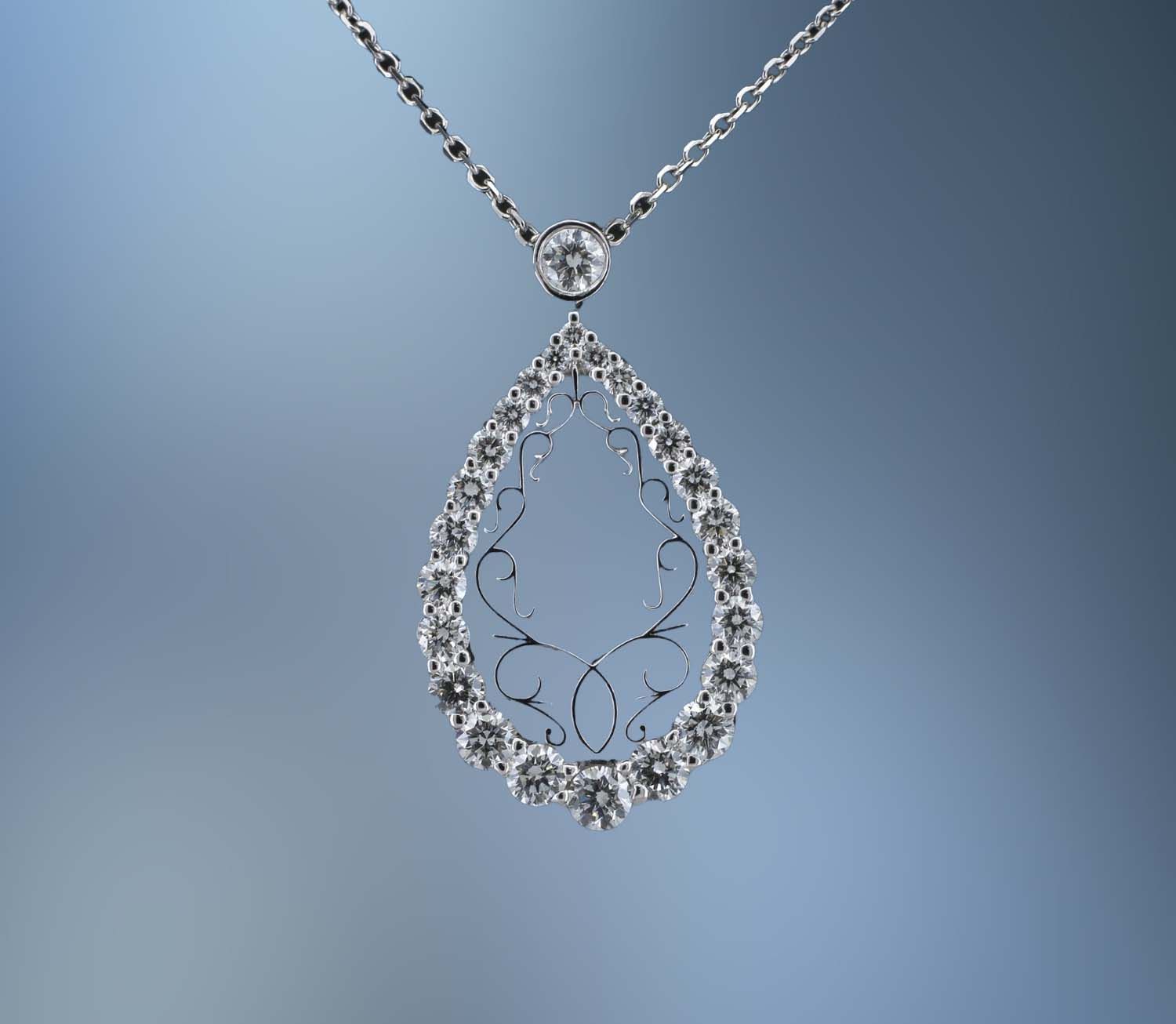 NJ4373 LADY'S 14KT WHITE GOLD PEAR SHAPED PENDANT FEATURING 25 ROUND BRILLIANT CUT DIAMONDS TOTALING 1.08 CTS ON A 16 NJ4373 LADY'S 14KT WHITE GOLD PEAR SHAPED PENDANT FEATURING 25 ROUND BRILLIANT CUT DIAMONDS TOTALING 1.08 CTS ON A 16" CHAIN.