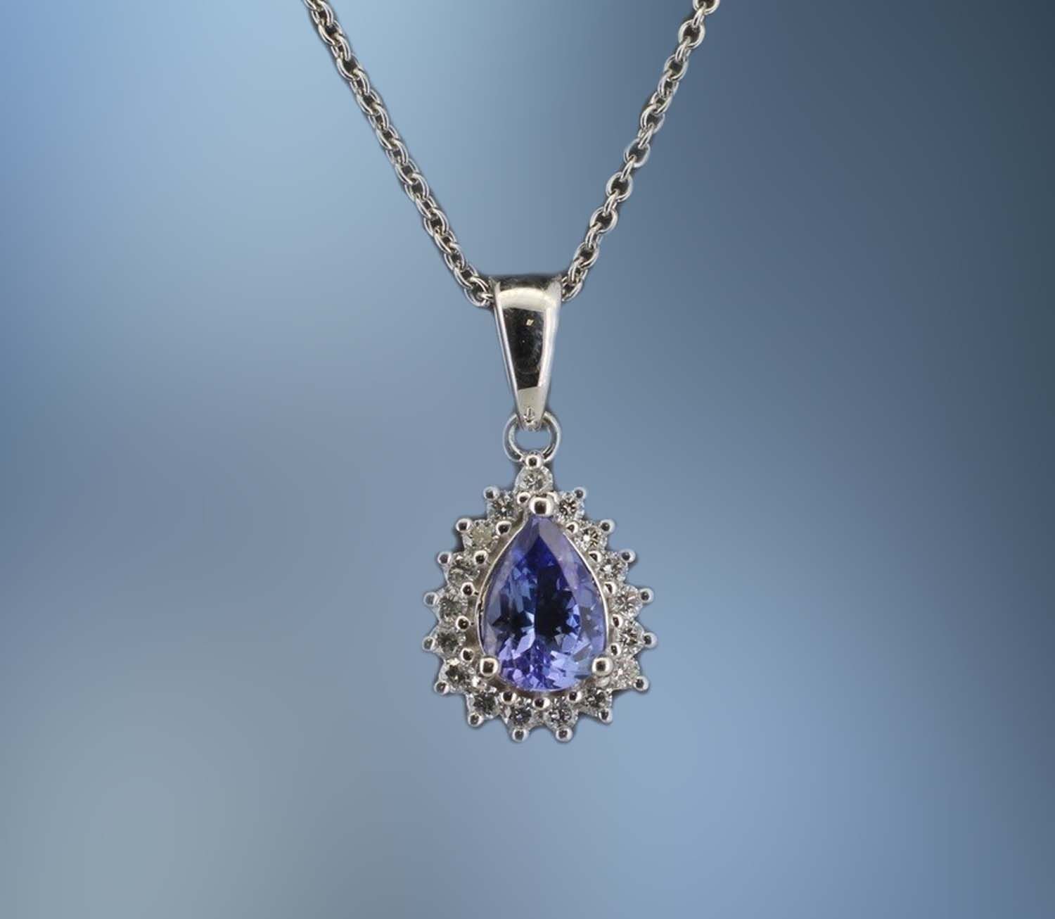 ONE 14KT WHITE GOLD DIAMOND AND TANZANITE PENDANT CONTAINING ONE .65 CT PEAR SHAPE TANZANITE AND .17 CTS. OF NATURAL ROUND BRILLIANT CUT DIAMONDS. ONE 14KT WHITE GOLD DIAMOND AND TANZANITE PENDANT CONTAINING ONE .65 CT PEAR SHAPE TANZANITE AND .17 CTS. OF NATURAL ROUND BRILLIANT CUT DIAMONDS.
