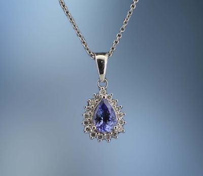 ONE 14KT WHITE GOLD DIAMOND AND TANZANITE PENDANT CONTAINING ONE .65 CT PEAR SHAPE TANZANITE AND .17 CTS. OF NATURAL ROUND BRILLIANT CUT DIAMONDS. ONE 14KT WHITE GOLD DIAMOND AND TANZANITE PENDANT CONTAINING ONE .65 CT PEAR SHAPE TANZANITE AND .17 CTS. OF NATURAL ROUND BRILLIANT CUT DIAMONDS.