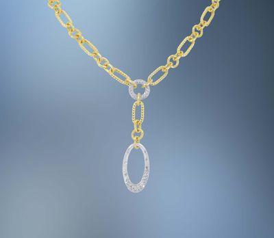 ONE 14KT WHITE AND YELLOW GOLD LADIES DIAMOND PENDANT CONTAINING .29 CTS OF NATURAL ROUND BRILLIANT CUT DIAMONDS.ON AN 18" PAPERCLIP CHAIN