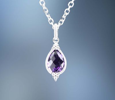 ONE 14KT WHITE GOLD LADIES AMETHYST AND DIAMOND PENDANT CONTAINING ONE .70 CT PEAR SHAPE AMETHYST AND .03 CTS. OF NATURAL ROUND BRILLIANT CUT DIAMONDS