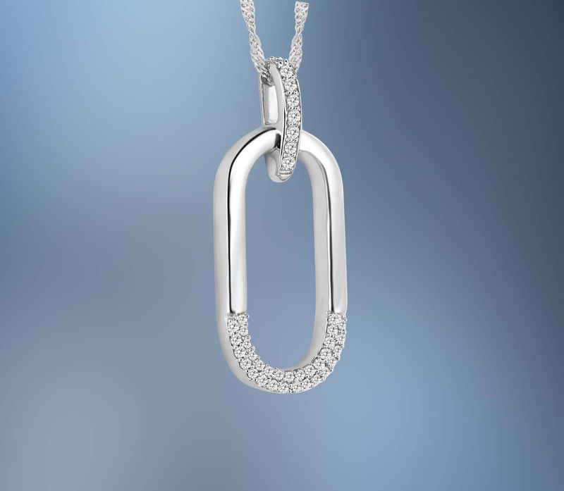 ONE 14KT WHITE GOLD LADIES DIAMOND PENDANT CONTAINING .16 CTS. OF NATURAL ROUND BRILLIANT CUT DIAMONDS ON A 16" CHAIN