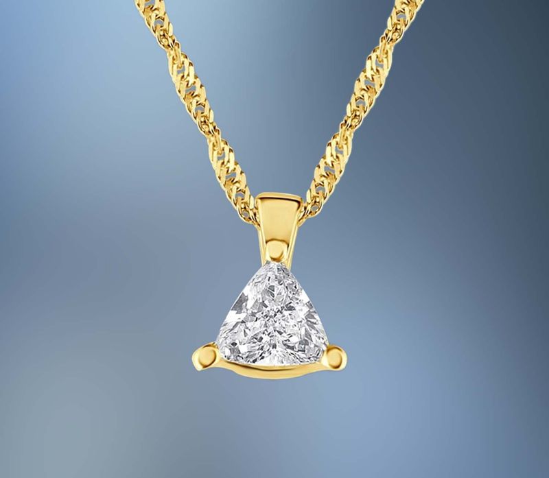 ONE 14KT YELLOW GOLD DIAMOND PENDANT CONTAINING ONE PRONG SET .39 CT. NATURAL TRILLION CUT DIAMOND