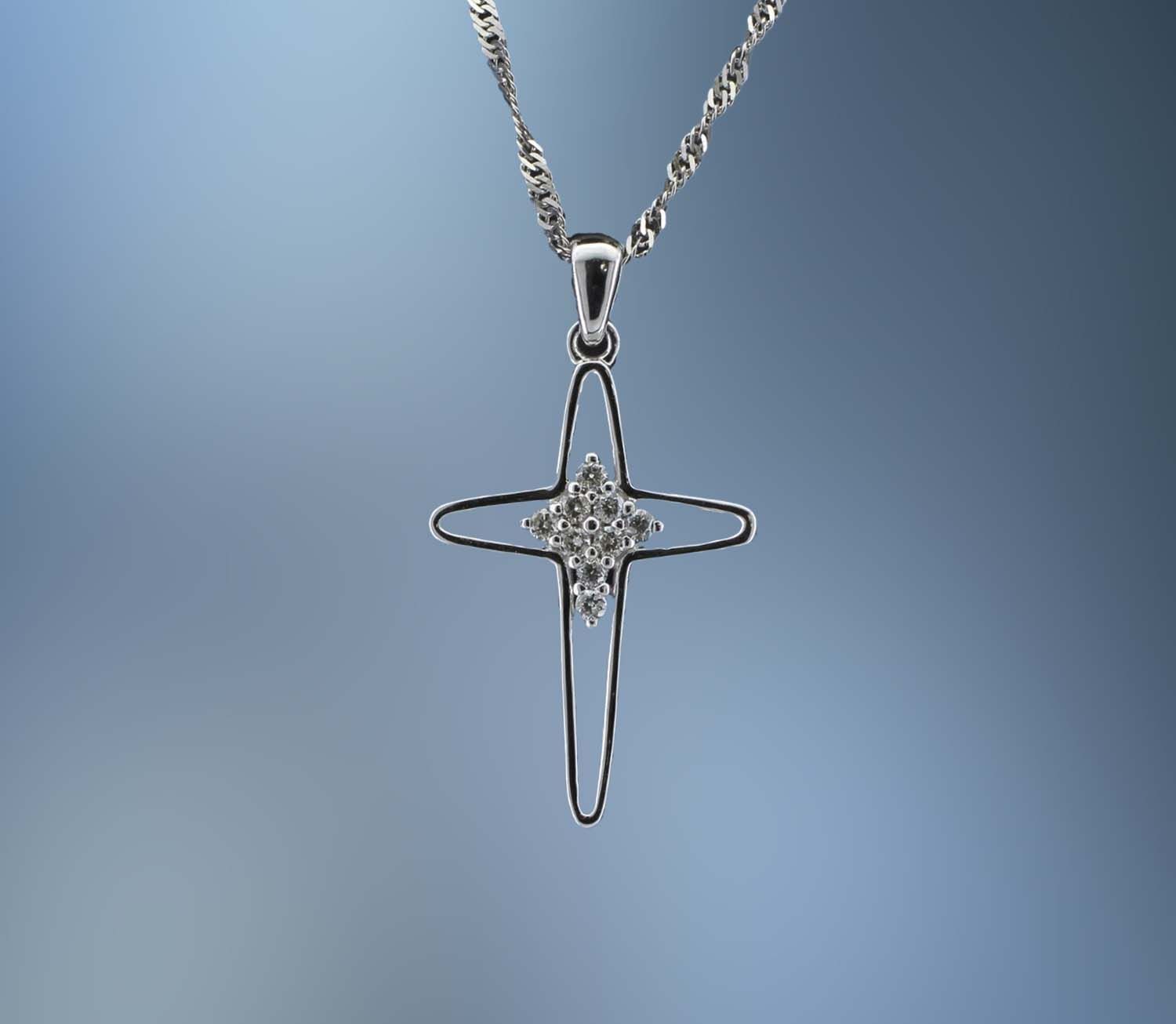 TP2233W 14KT WHITE GOLD AND DIAMOND CROSS PENDANT FEATURING 9 ROUND BRILLIANT CUT DIAMONDS TOTALING 0.10 CTS TP2233W 14KT WHITE GOLD AND DIAMOND CROSS PENDANT FEATURING 9 ROUND BRILLIANT CUT DIAMONDS TOTALING 0.10 CTS