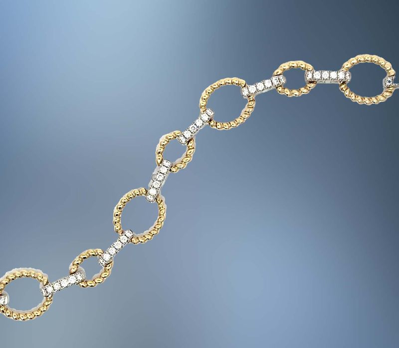 ONE 14KT TWO TONED OVAL LINK DIAMOND BRACELET