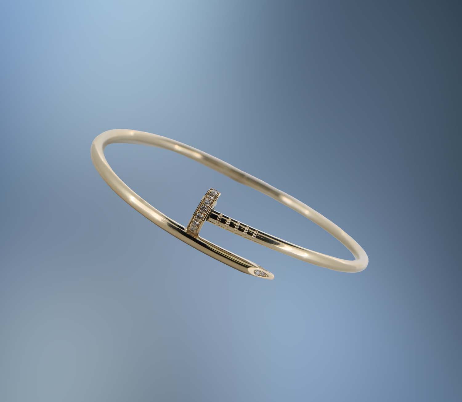 ONE 14KT YELLOW GOLD LADIES DIAMOND "NAIL" BRACELET