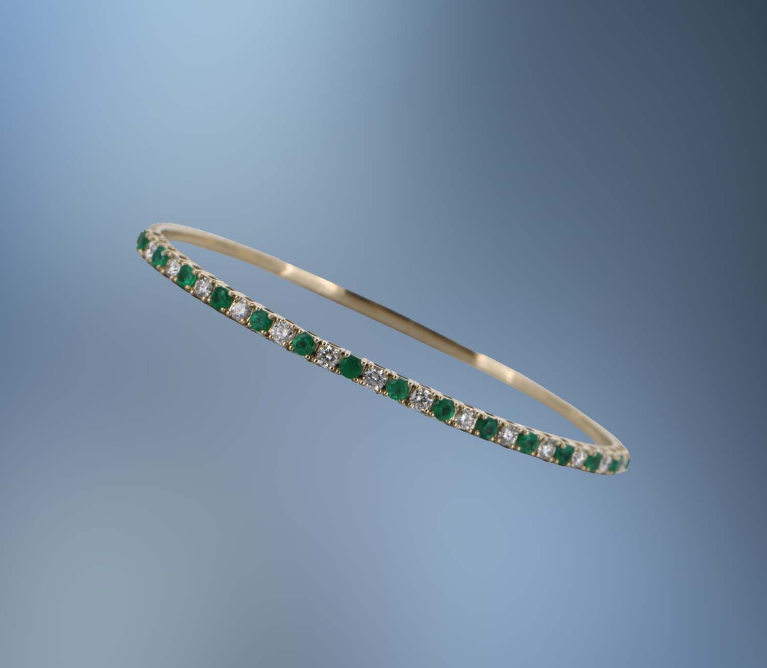 14KT YELLOW GOLD FLEXIBLE DIAMOND AND EMERALD BRACELET