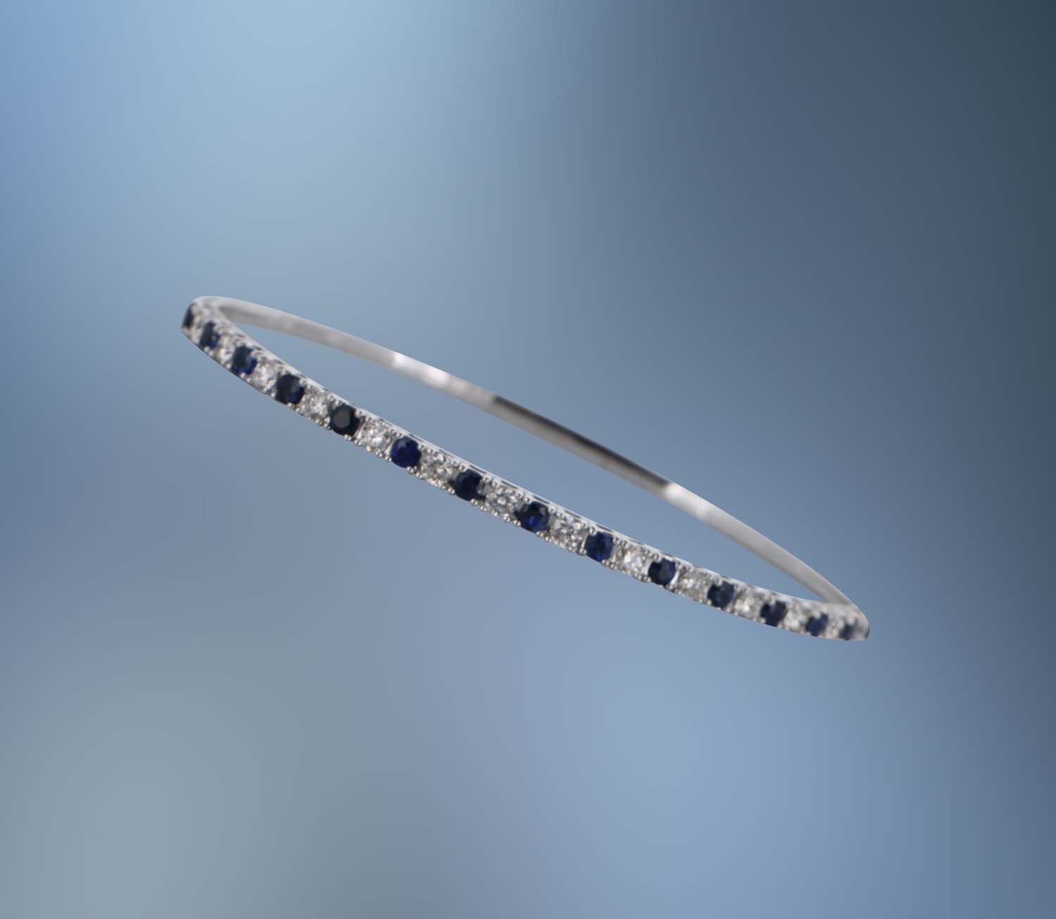14KT WHITE GOLD FLEXIBLE DIAMOND AND SAPPHIRE BANGLE