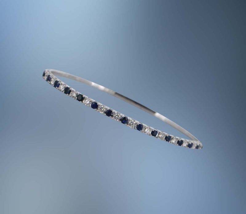 14KT WHITE GOLD FLEXIBLE DIAMOND AND SAPPHIRE BANGLE